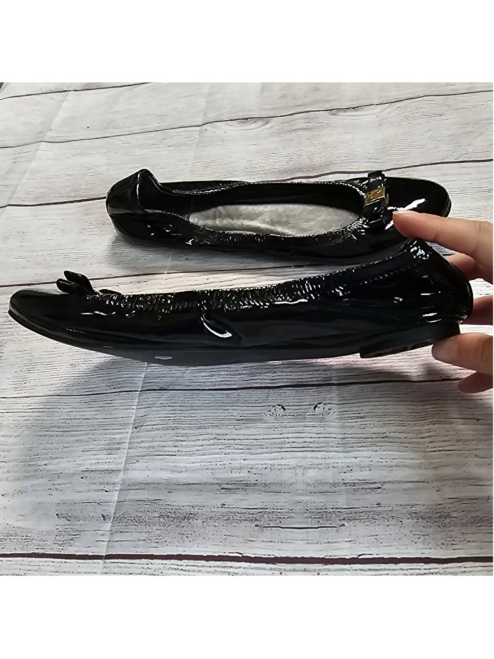 Tory Burch 10M shiny black ballerina flats with black and gold bow accent